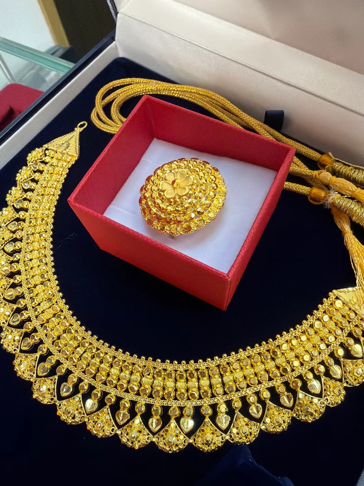 Gold necklace and ring in a Lama Jewellers box