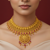 Gold necklace with red stones on a red background